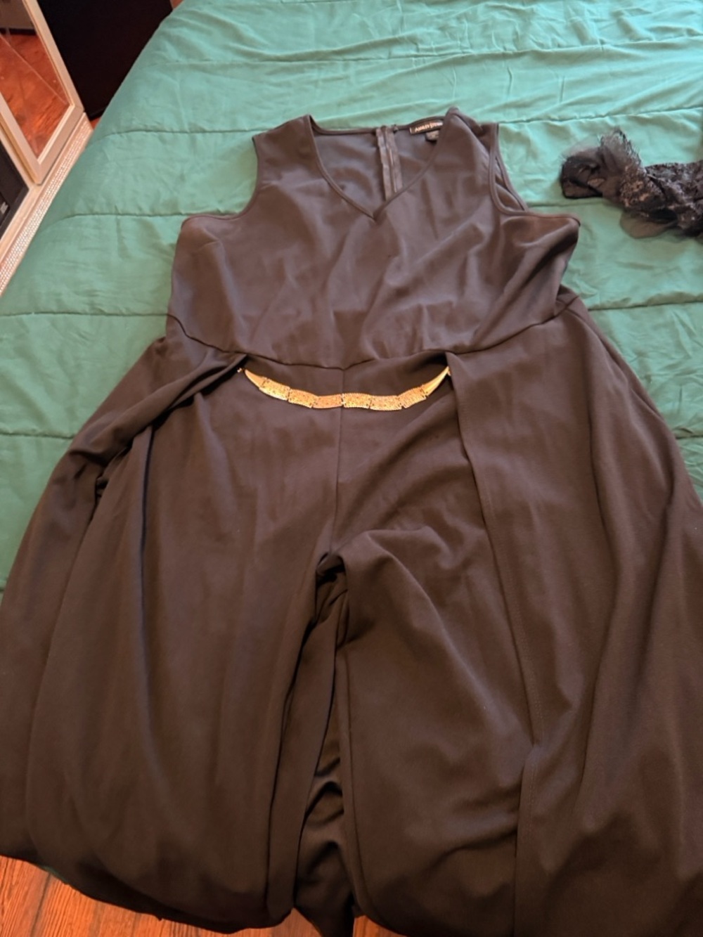 Fashion Nova Black Boot-Cut Flare Jumpsuit with Gold Waist Detail